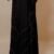 Full-length front view of black abaya with silver thread lines and wide sleeves.
